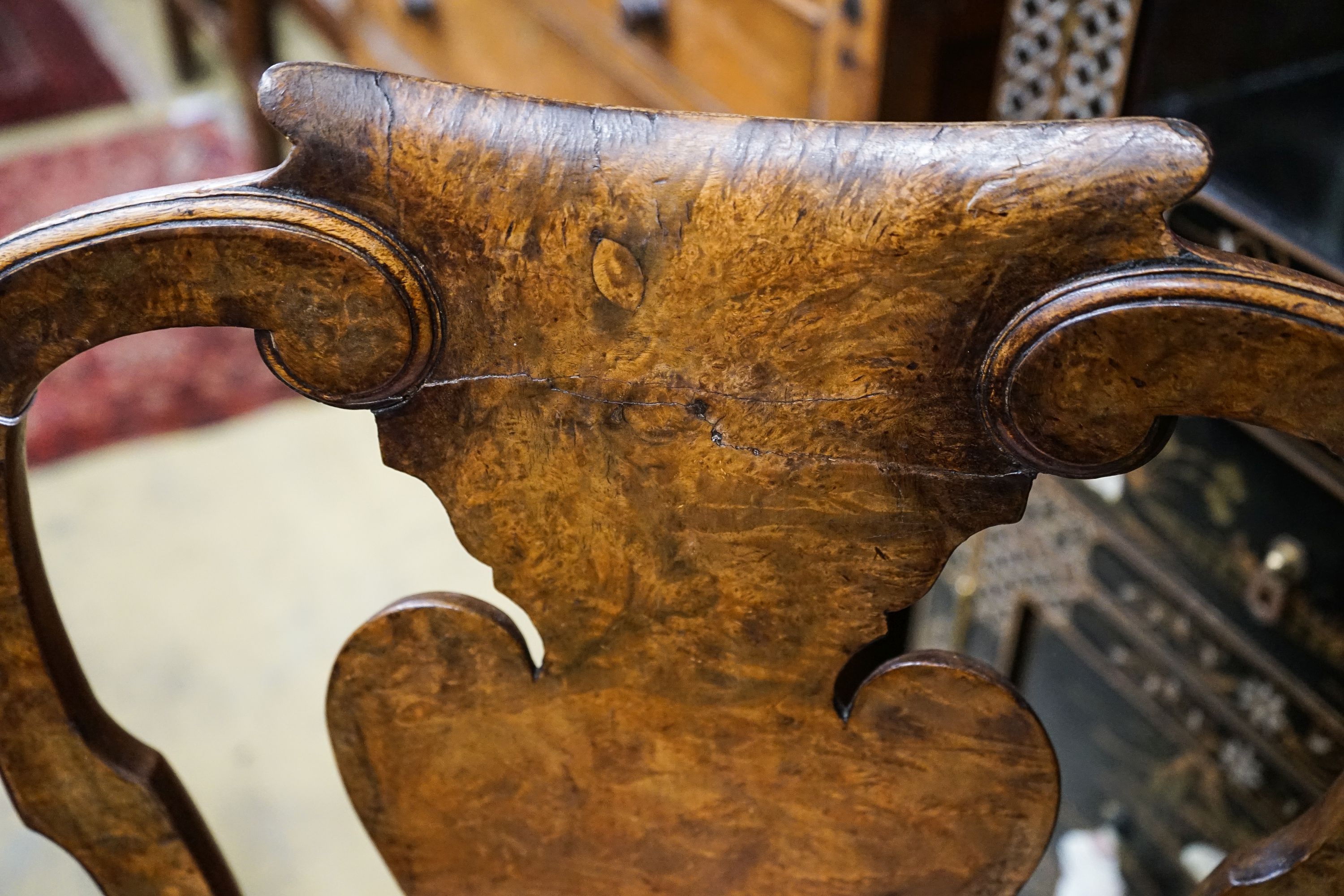 A set of four Queen Anne revival walnut dining chairs